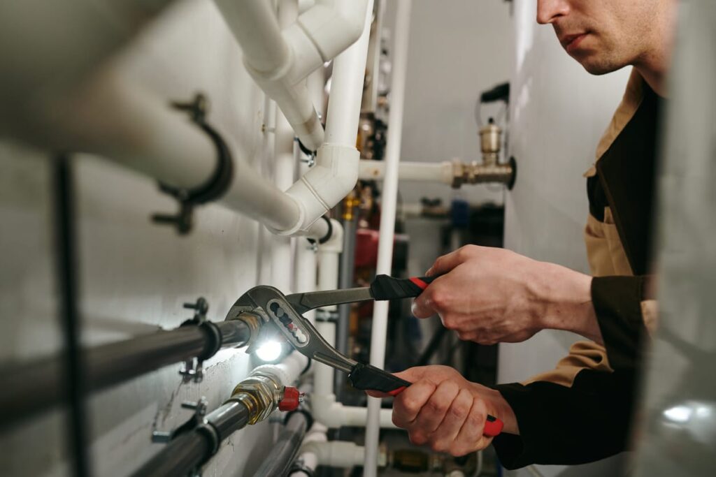 Plumbers maintaining commercial plumbing pipes in Corvallis